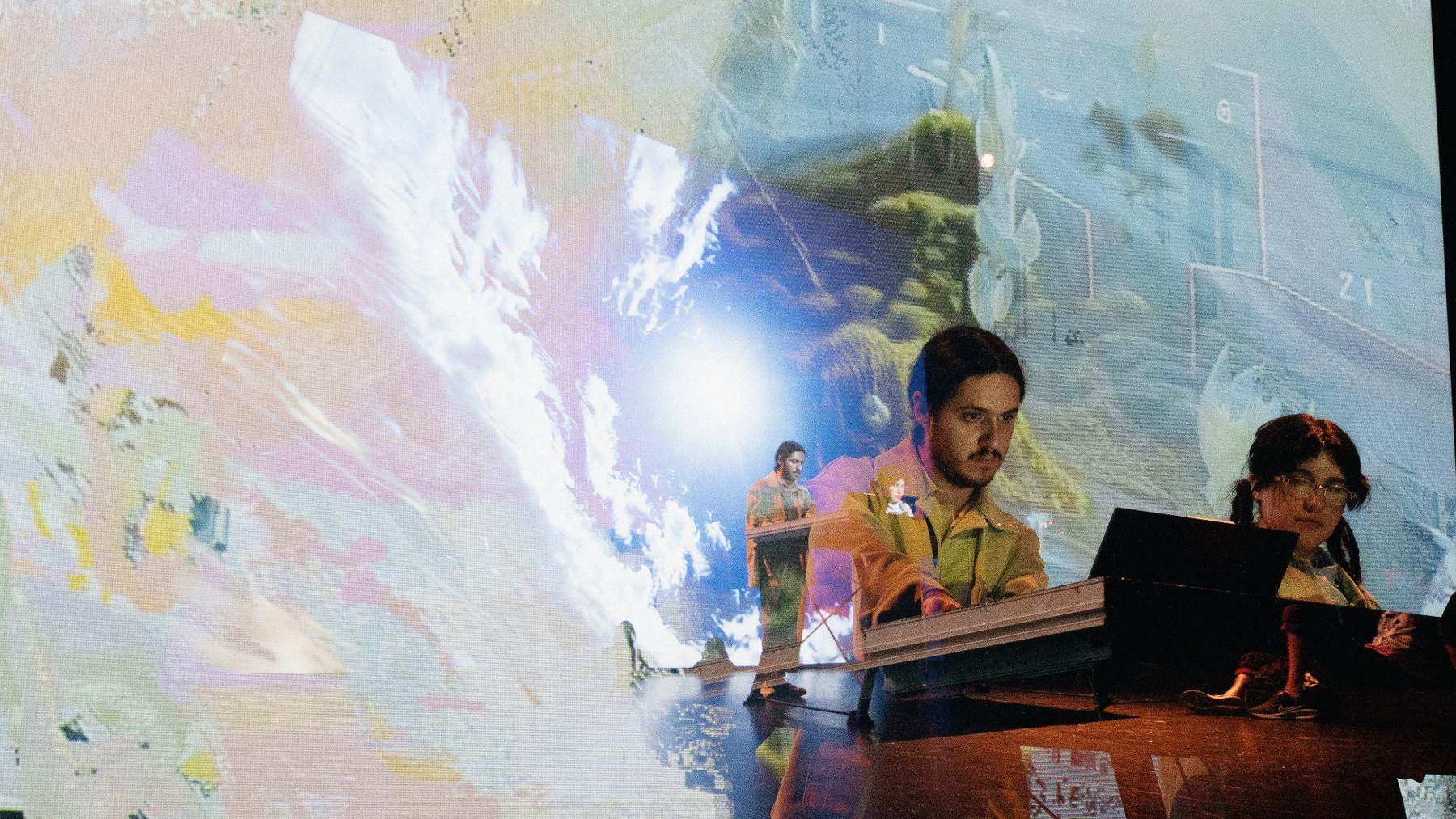Live presentation with projected generative imagery.